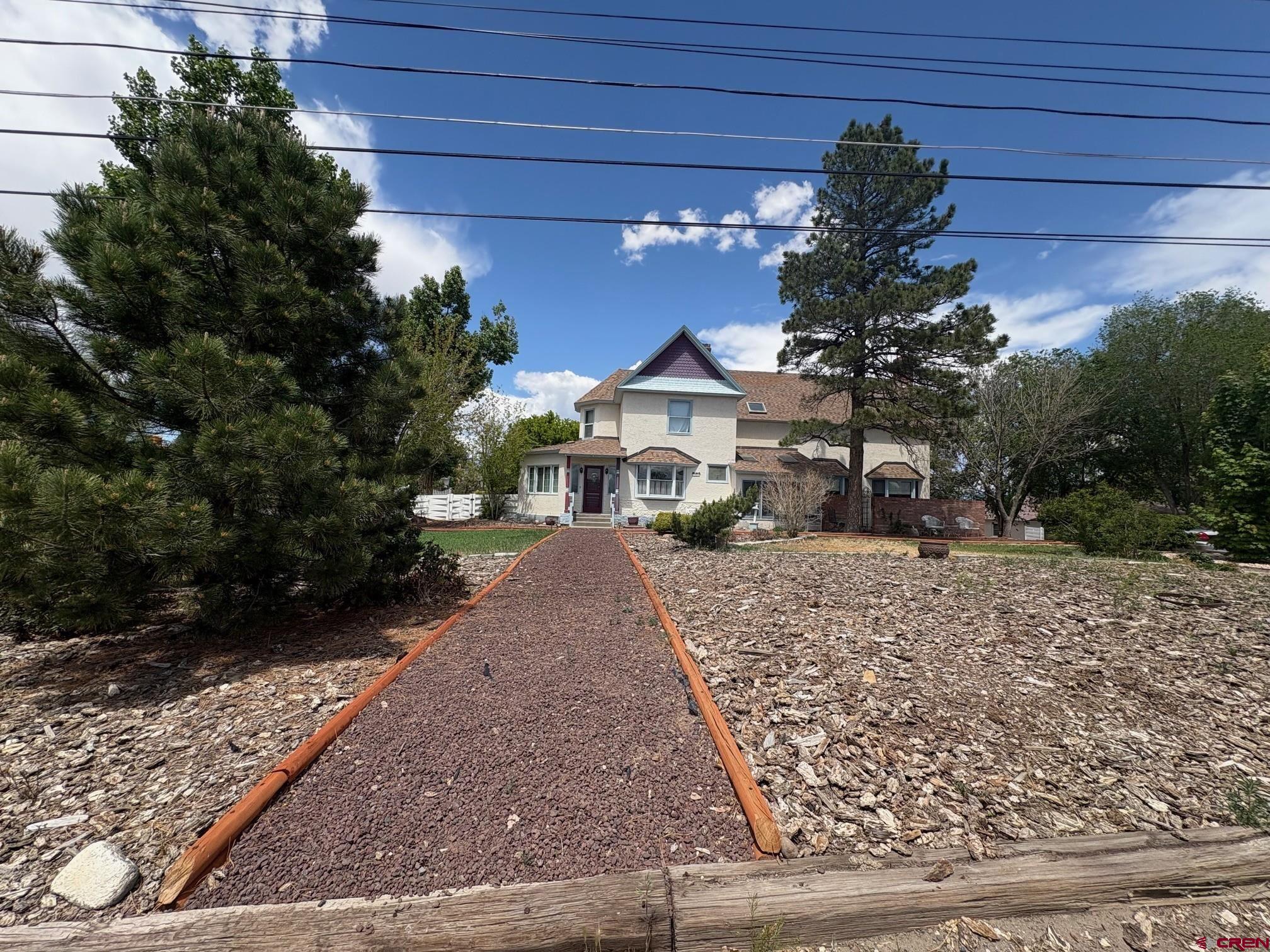 184 Garnet Avenue Delta, CO 81416 - Photo 2 of 36 a front view of a house with a yard