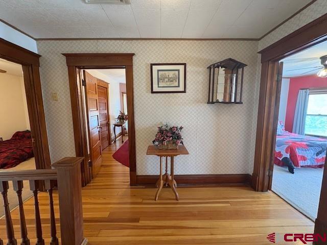 184 Garnet Avenue Delta, CO 81416 - Photo 22 of 36 a view of a hallway with wooden floor and staircase