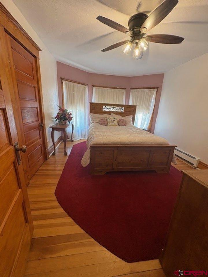 184 Garnet Avenue Delta, CO 81416 - Photo 24 of 36 a bed sitting in a bedroom next to a window