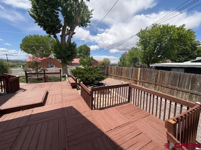 184 Garnet Avenue Delta, CO 81416 - Photo 32 of 36 a view of balcony with wooden floor and outdoor seating