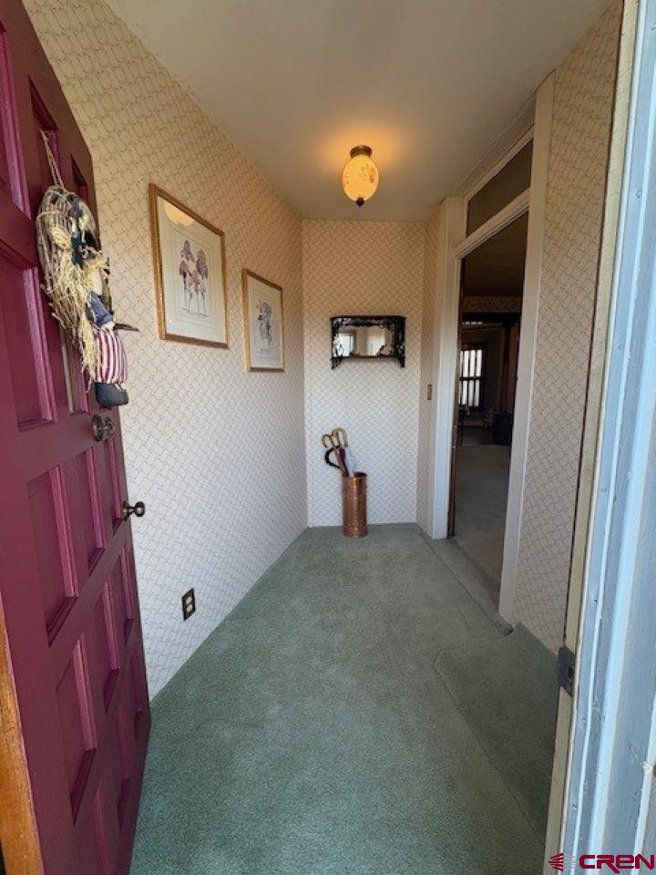 184 Garnet Avenue Delta, CO 81416 - Photo 6 of 36 a view of a hallway to rooms