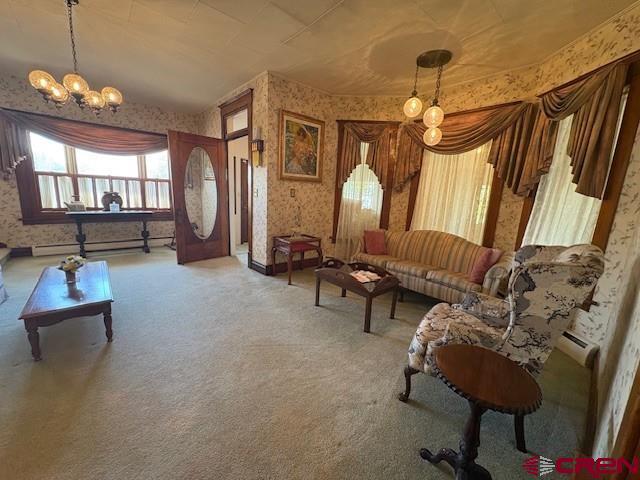 184 Garnet Avenue Delta, CO 81416 - Photo 7 of 36 a living room with furniture and a chandelier