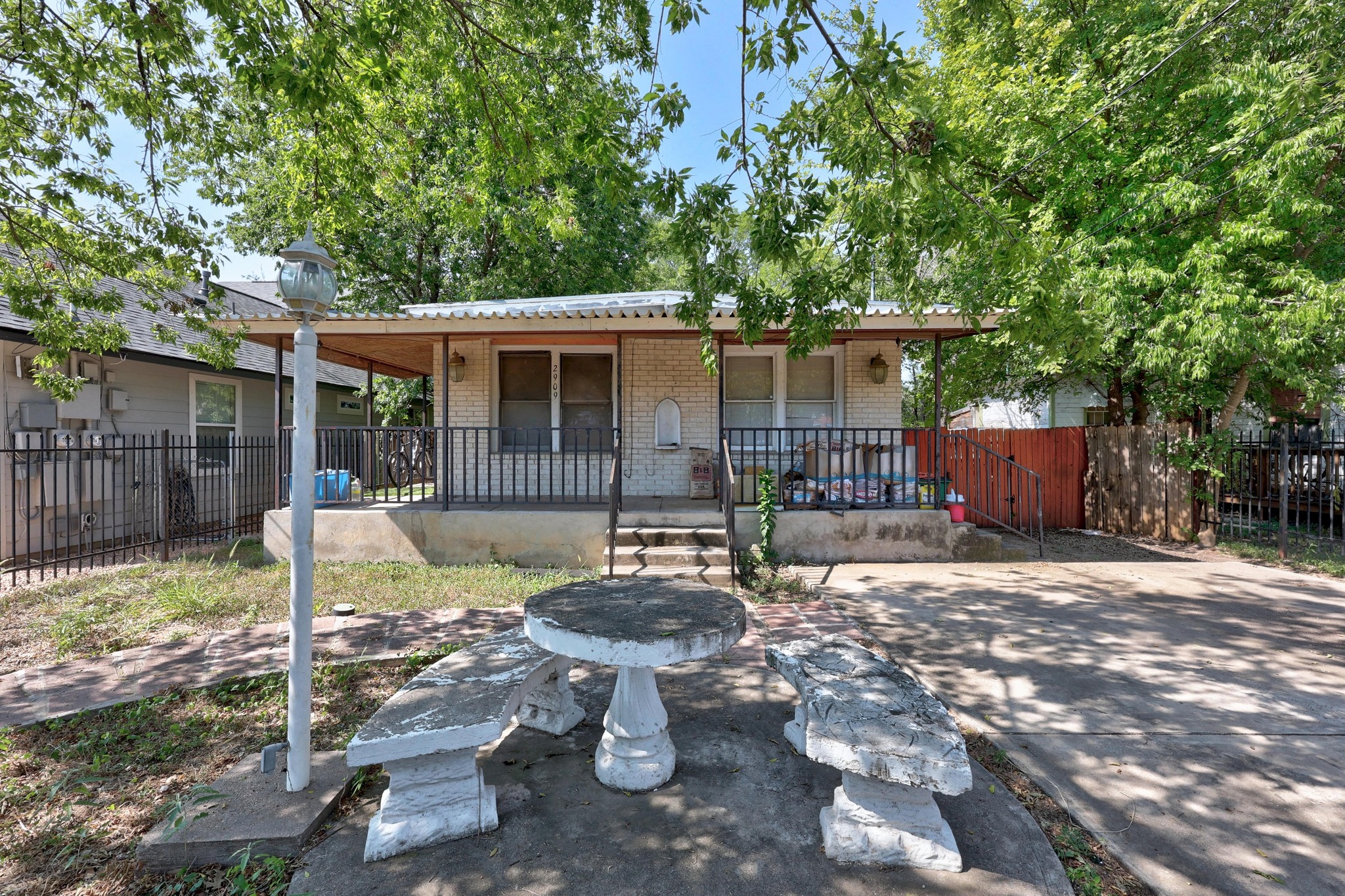 2909 East 5th Street Austin, TX 78702 - Photo 1 of 21 a backyard of a house with yard and outdoor seating