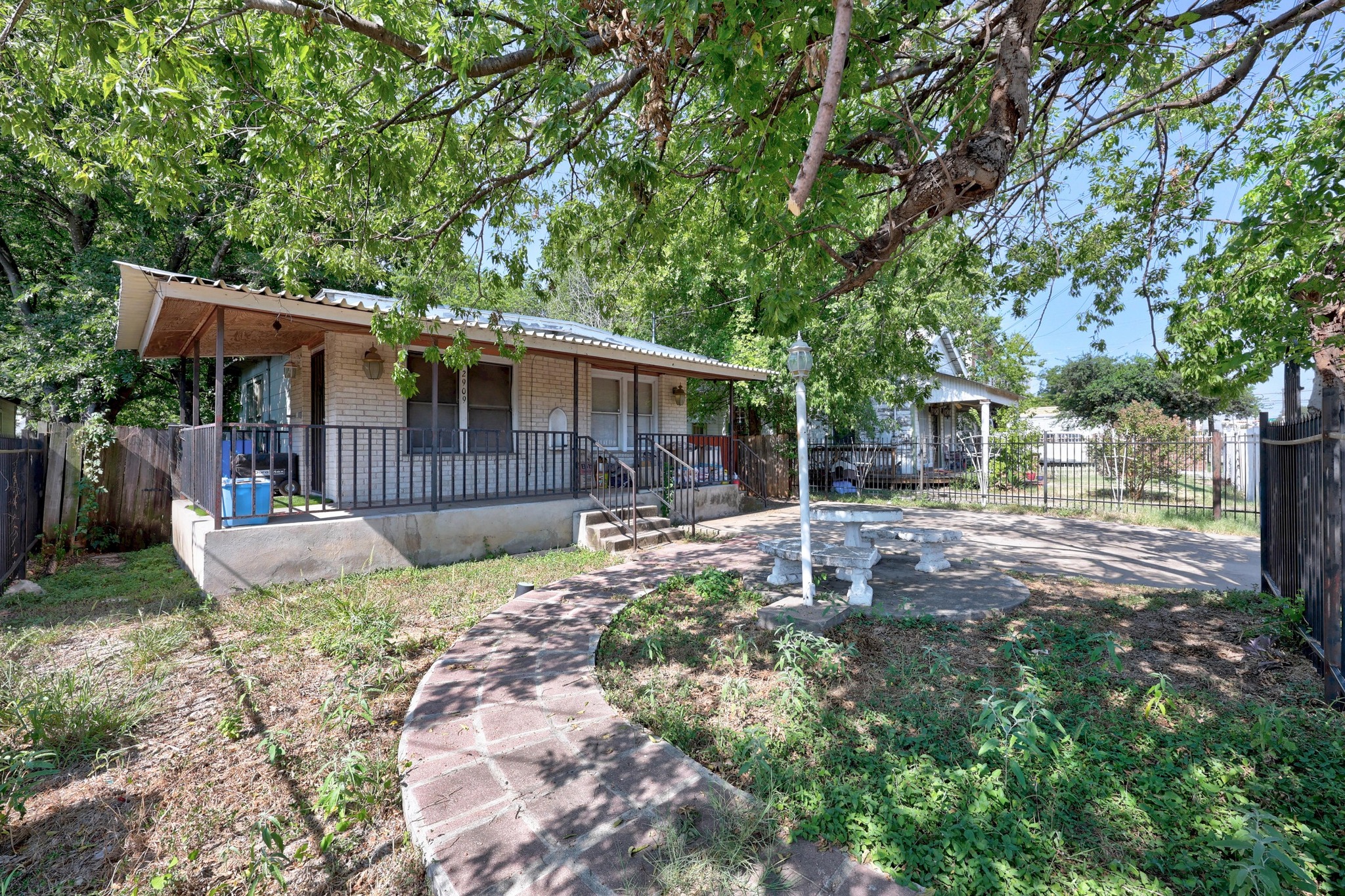 2909 East 5th Street Austin, TX 78702 - Photo 21 of 21 a backyard of a house with yard and outdoor seating