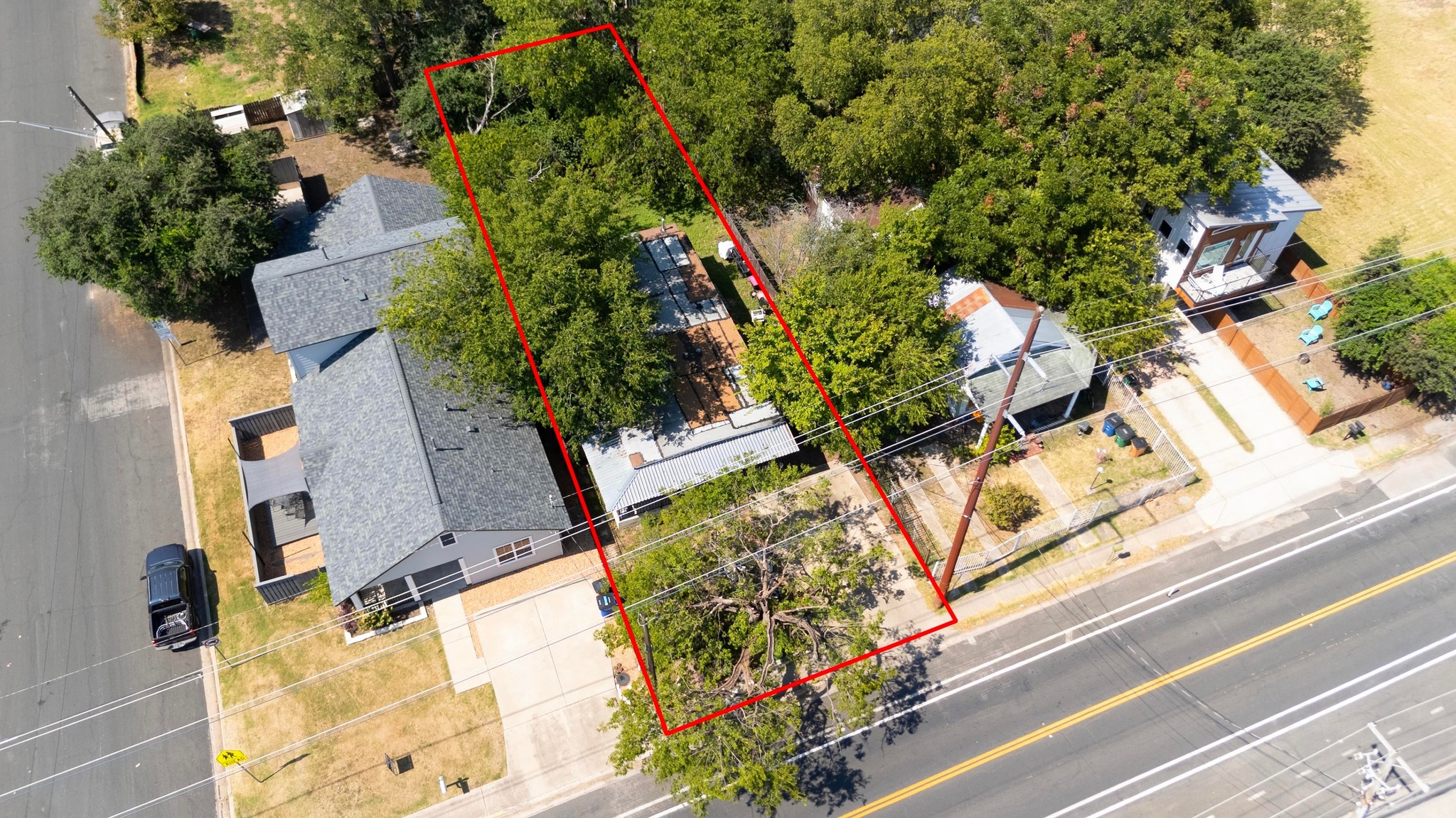 2909 East 5th Street Austin, TX 78702 - Photo 3 of 21 an aerial view of a house with a yard and garden