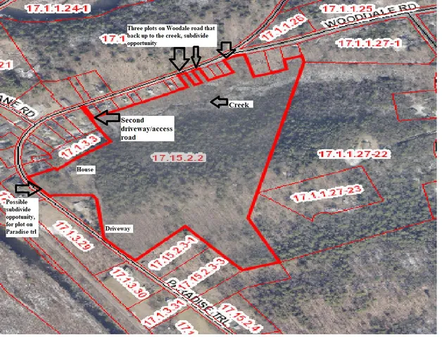 an aerial view of a house with outdoor space and a lake view