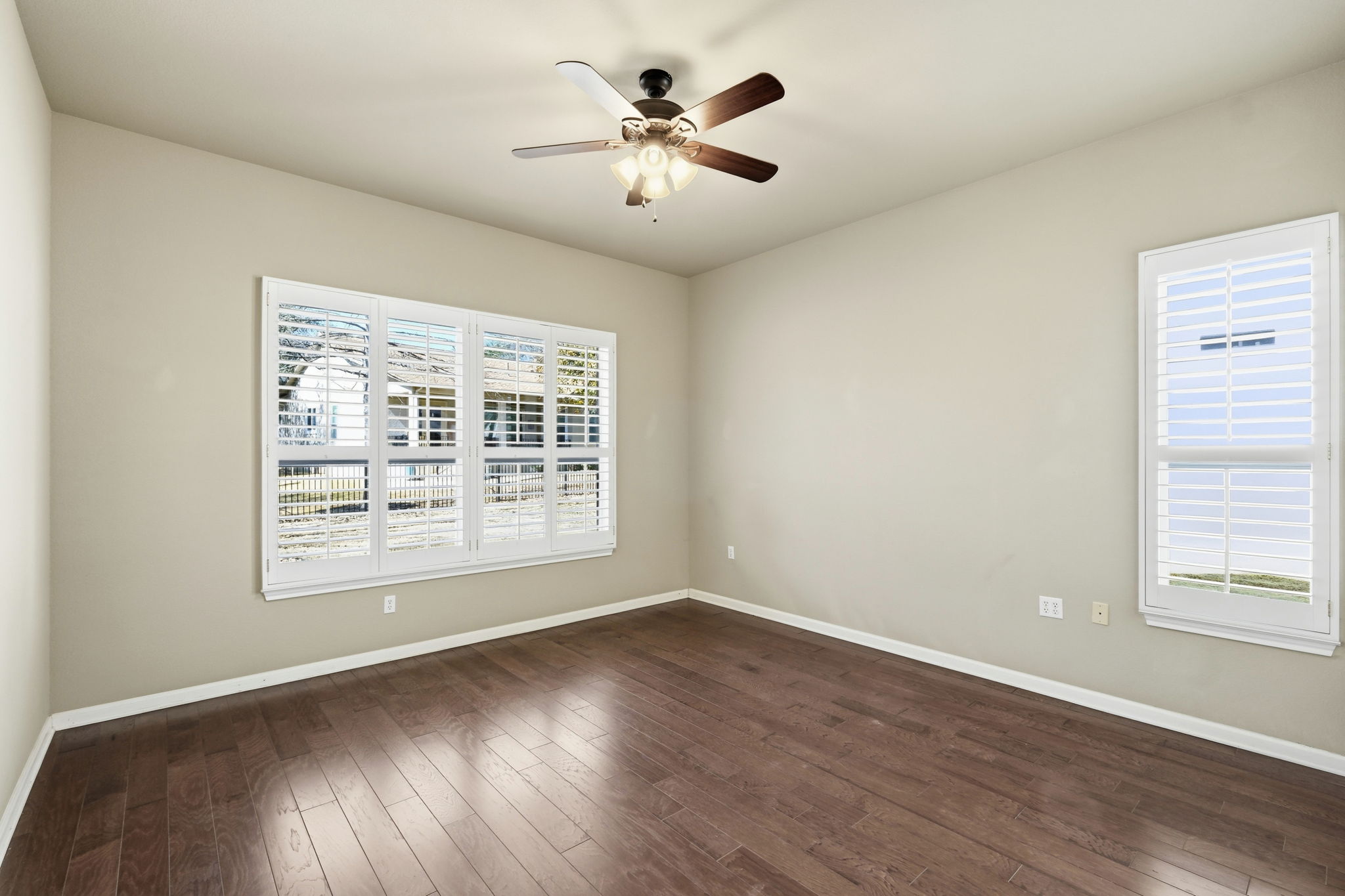 196 Whispering Wind Drive Georgetown, TX 78633 - Photo 12 of 34 a view of an empty room with wooden floor and a window