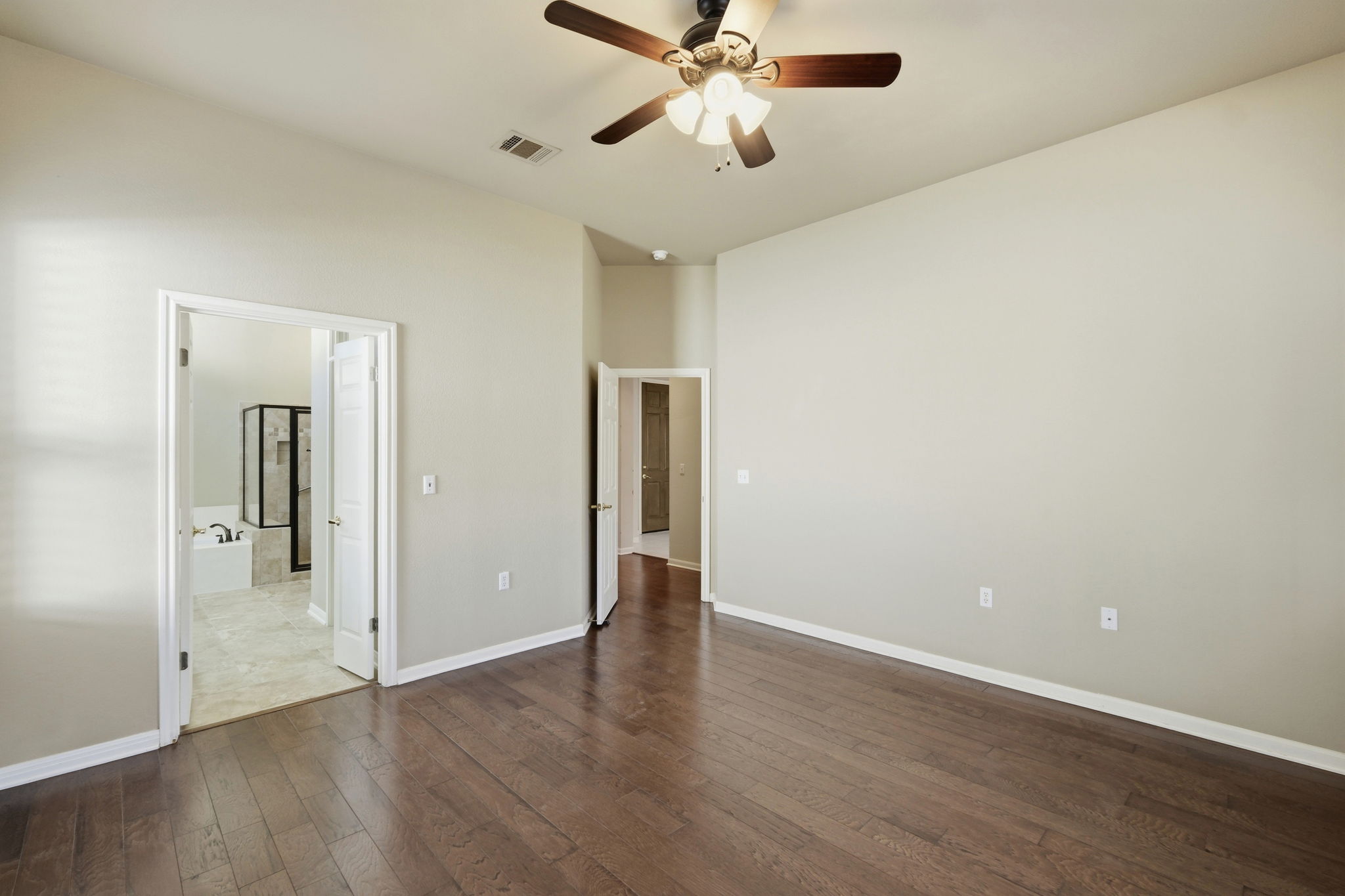 196 Whispering Wind Drive Georgetown, TX 78633 - Photo 15 of 34 a view of an empty room with wooden floor