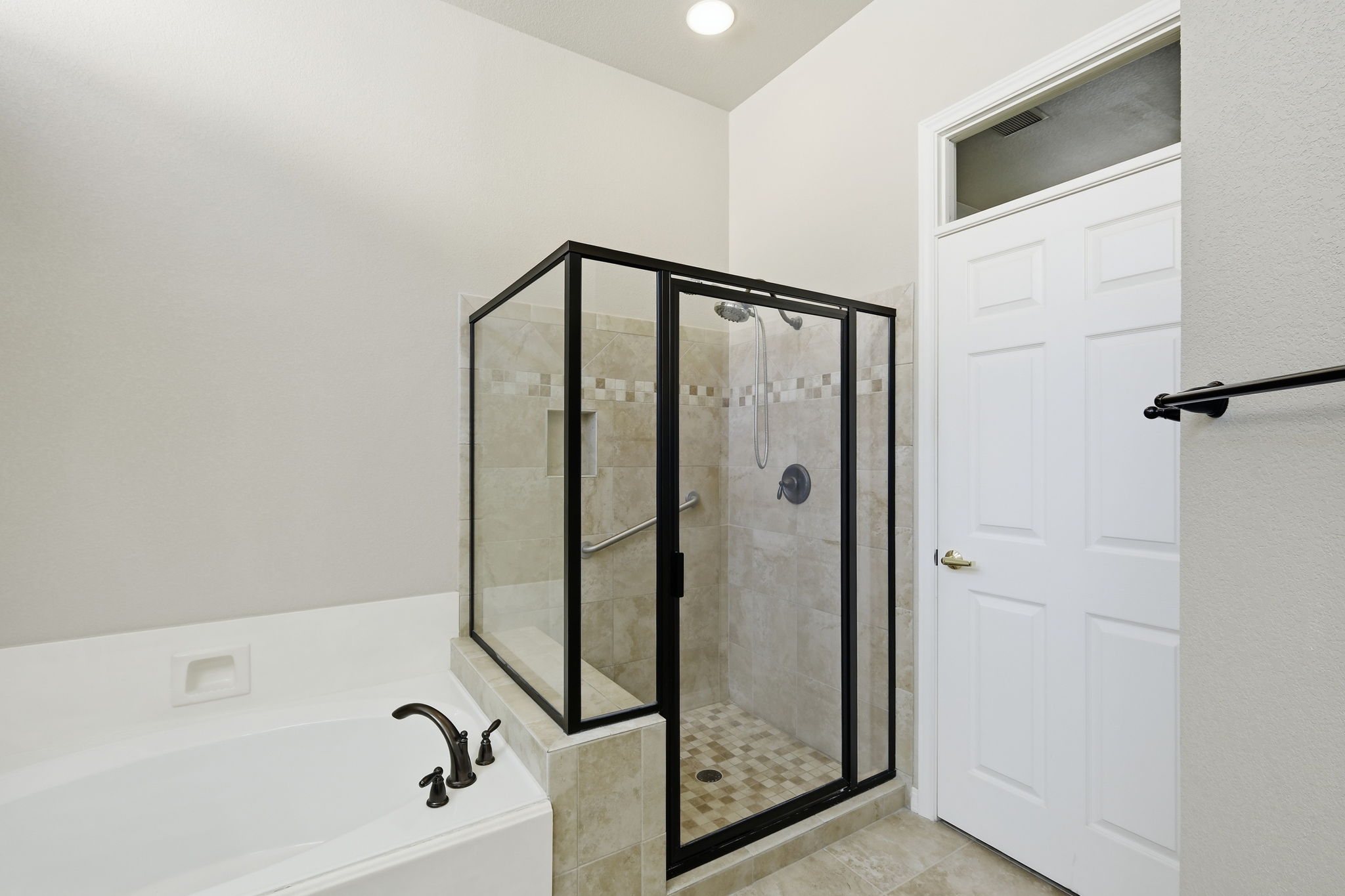 196 Whispering Wind Drive Georgetown, TX 78633 - Photo 17 of 34 a bathroom with a glass shower door