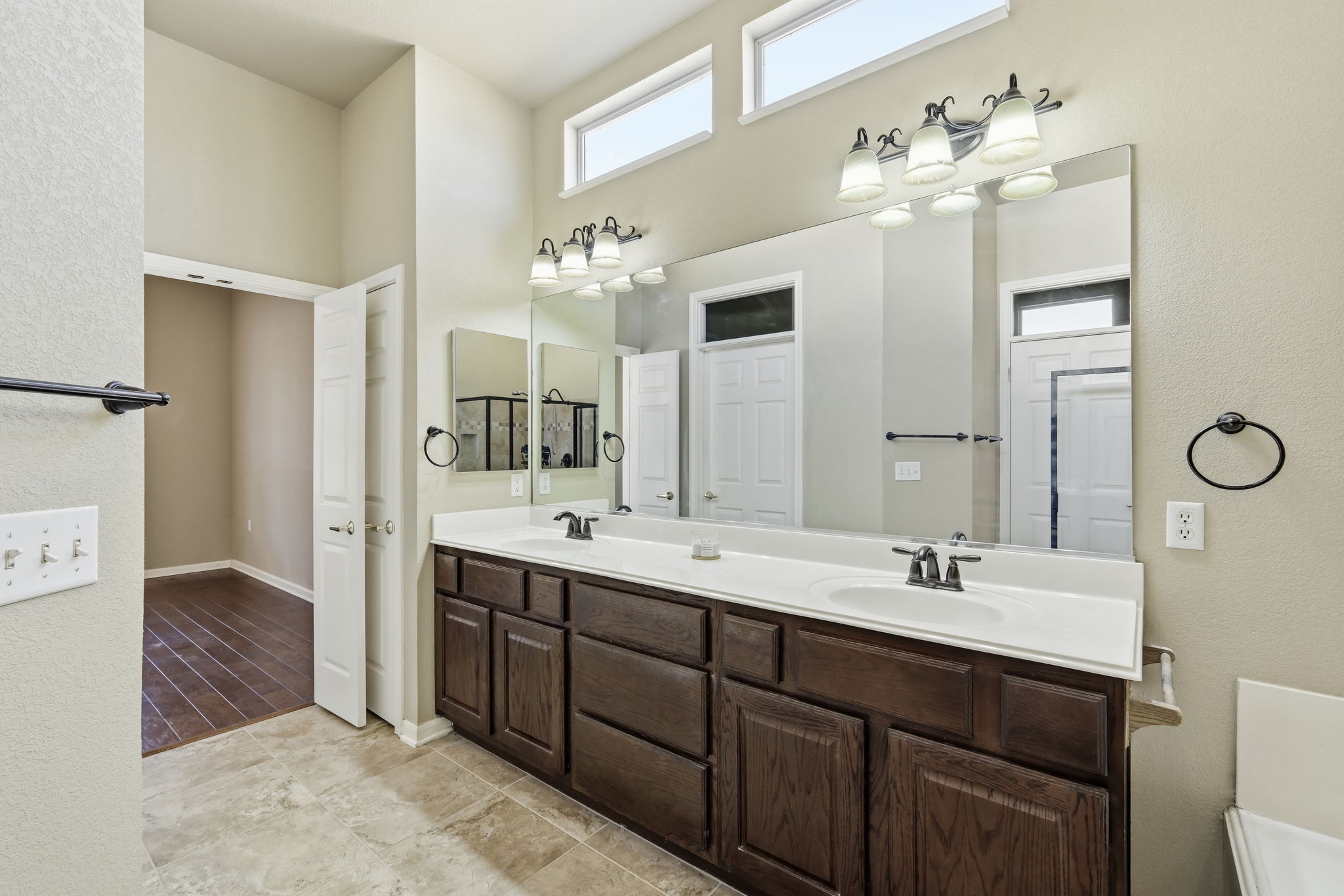 196 Whispering Wind Drive Georgetown, TX 78633 - Photo 18 of 34 a bathroom with a double vanity sink mirror and double