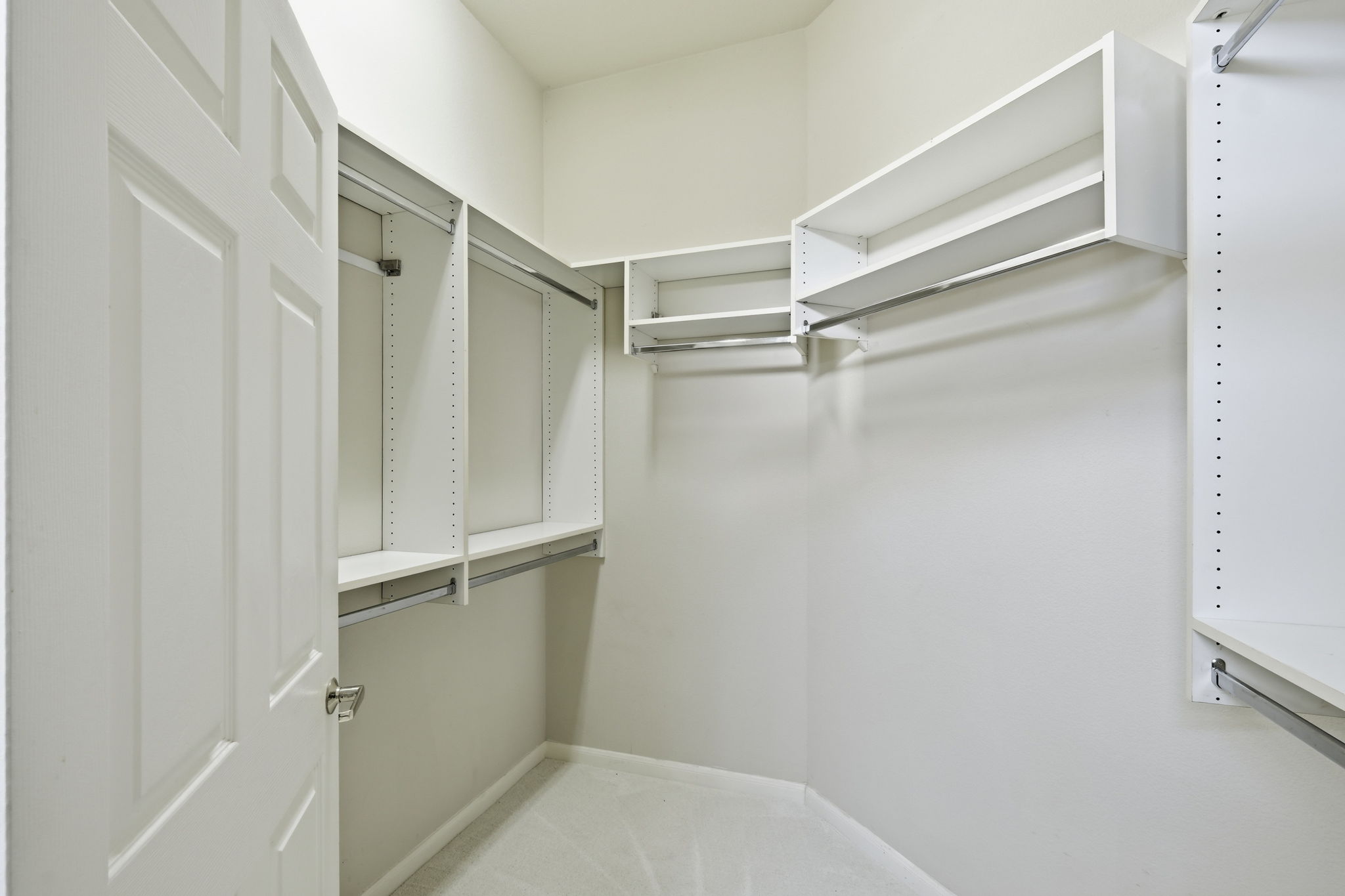 196 Whispering Wind Drive Georgetown, TX 78633 - Photo 19 of 34 a view of walk in closet with empty racks