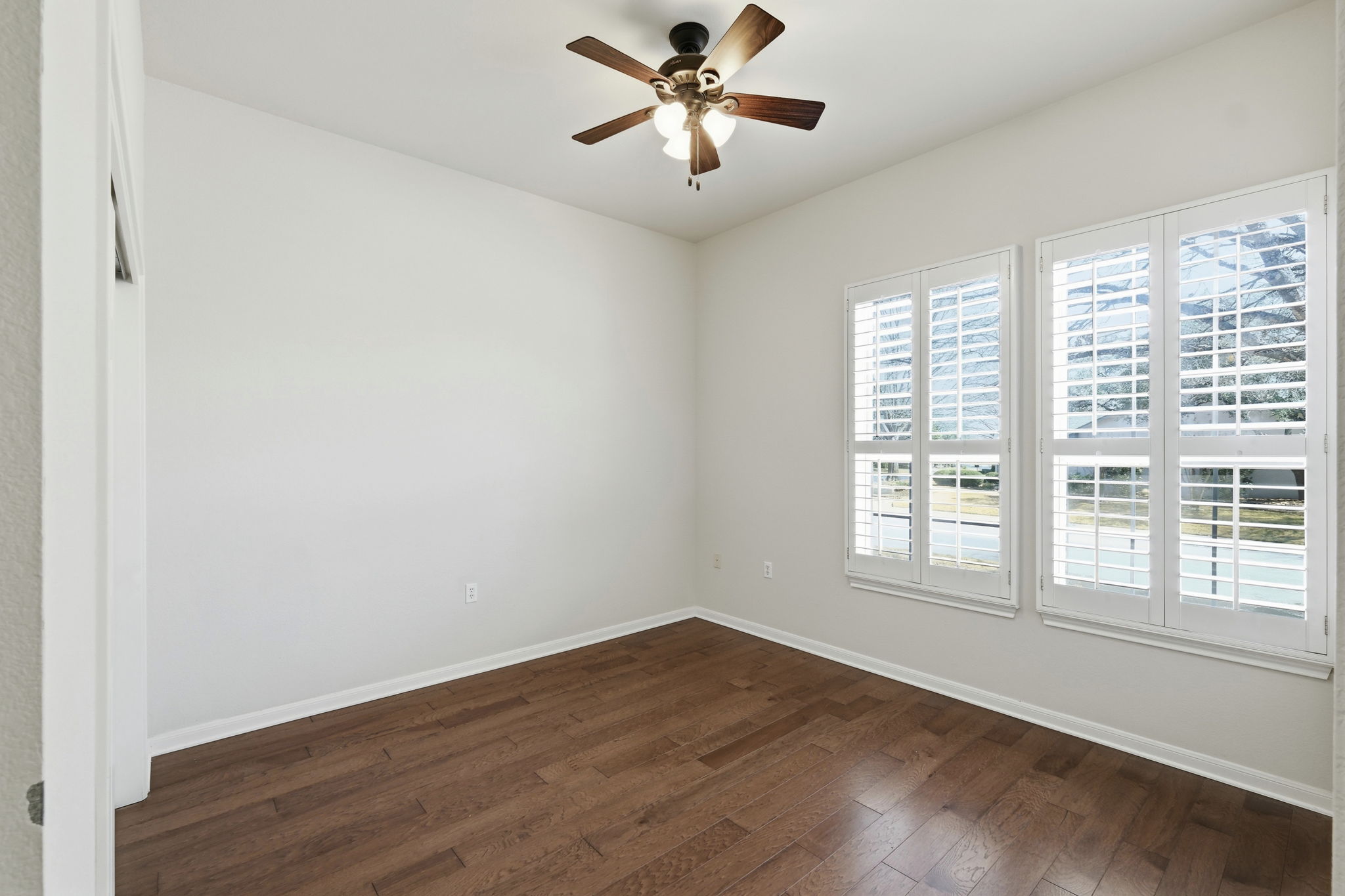 196 Whispering Wind Drive Georgetown, TX 78633 - Photo 20 of 34 wooden floor in an empty room with a window