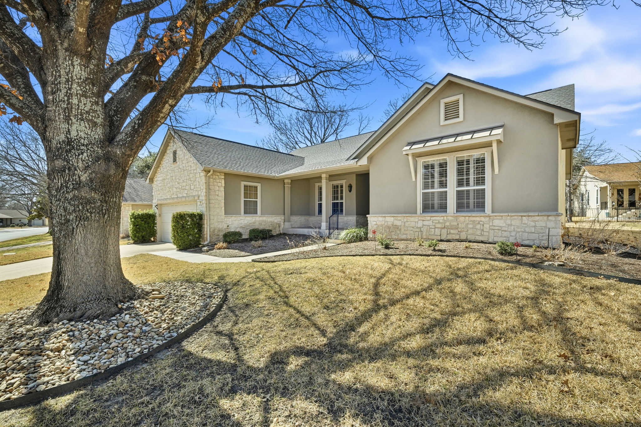 196 Whispering Wind Drive Georgetown, TX 78633 - Photo 2 of 34 a front view of a house with garden