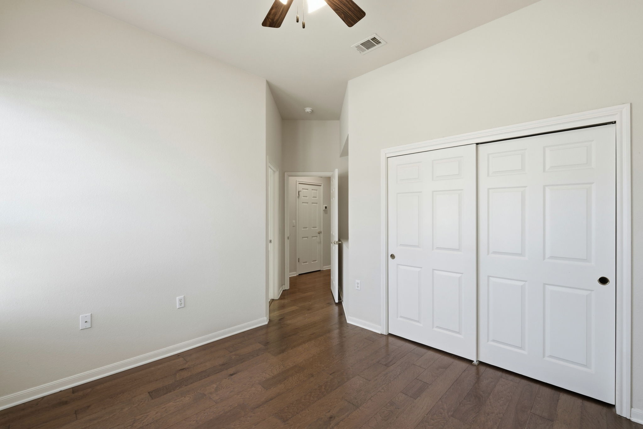 196 Whispering Wind Drive Georgetown, TX 78633 - Photo 21 of 34 an empty room with wooden floor and closet