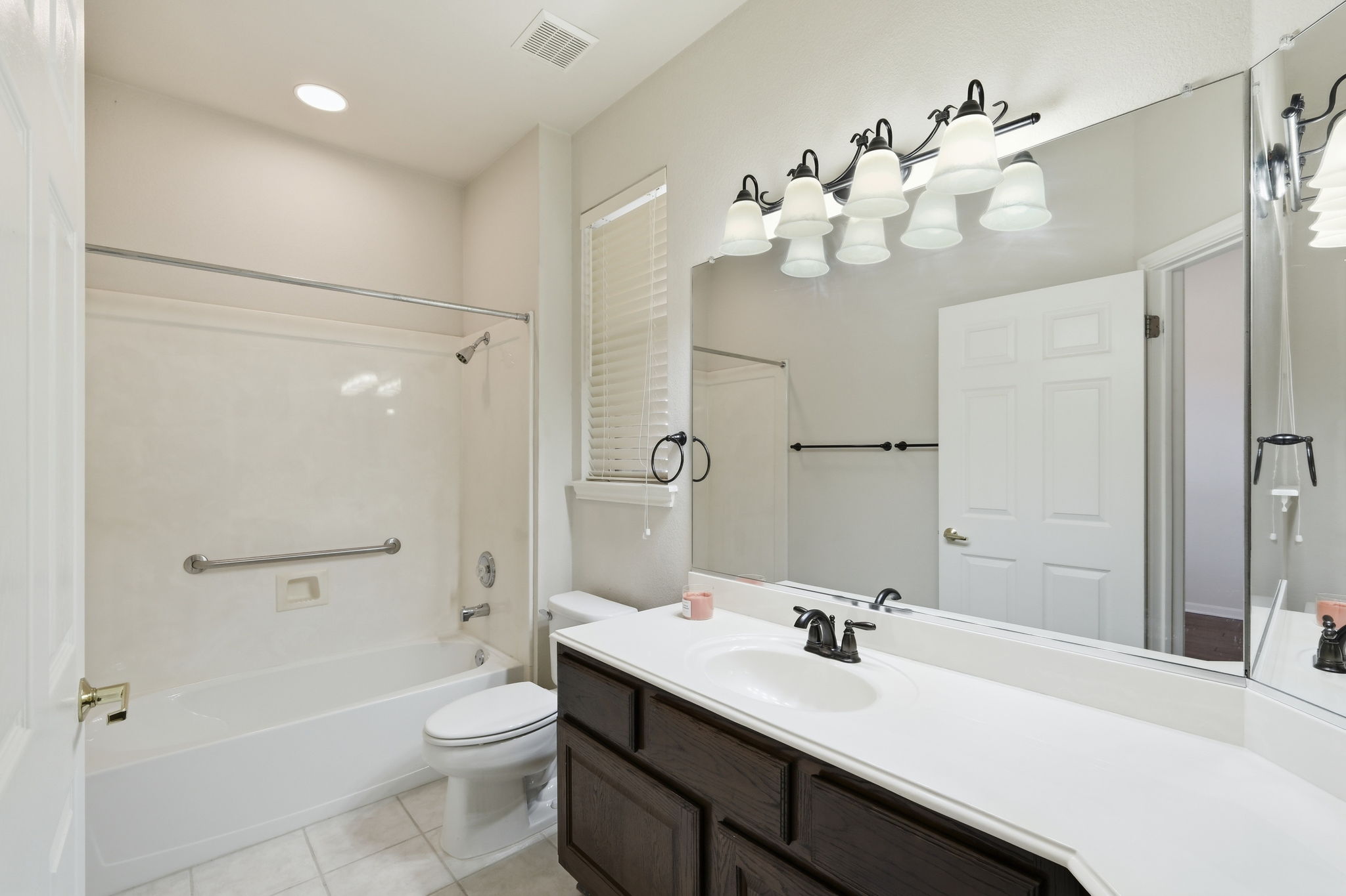 196 Whispering Wind Drive Georgetown, TX 78633 - Photo 22 of 34 a bathroom with a sink a toilet and shower