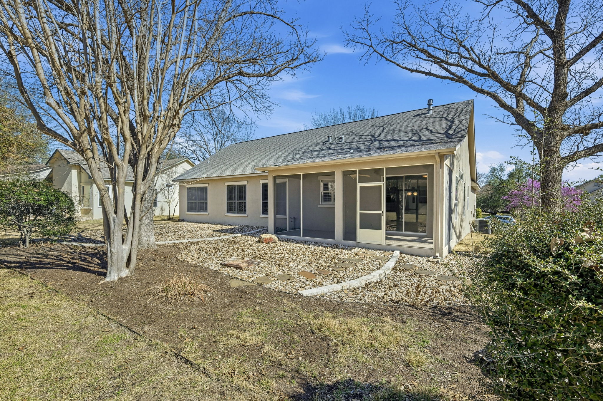 196 Whispering Wind Drive Georgetown, TX 78633 - Photo 26 of 34 a front view of a house with a garden