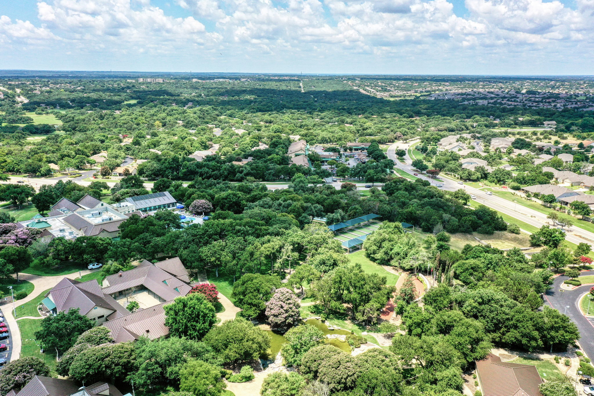 196 Whispering Wind Drive Georgetown, TX 78633 - Photo 29 of 34 an aerial view of residential houses with outdoor space and trees