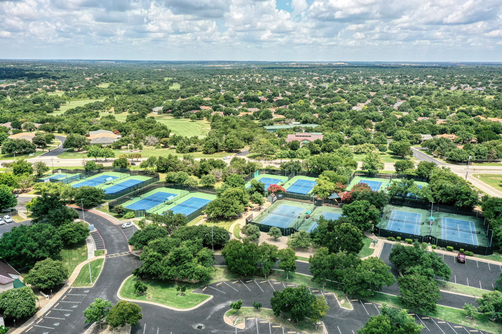 196 Whispering Wind Drive Georgetown, TX 78633 - Photo 32 of 34 an aerial view of residential houses with outdoor space and trees