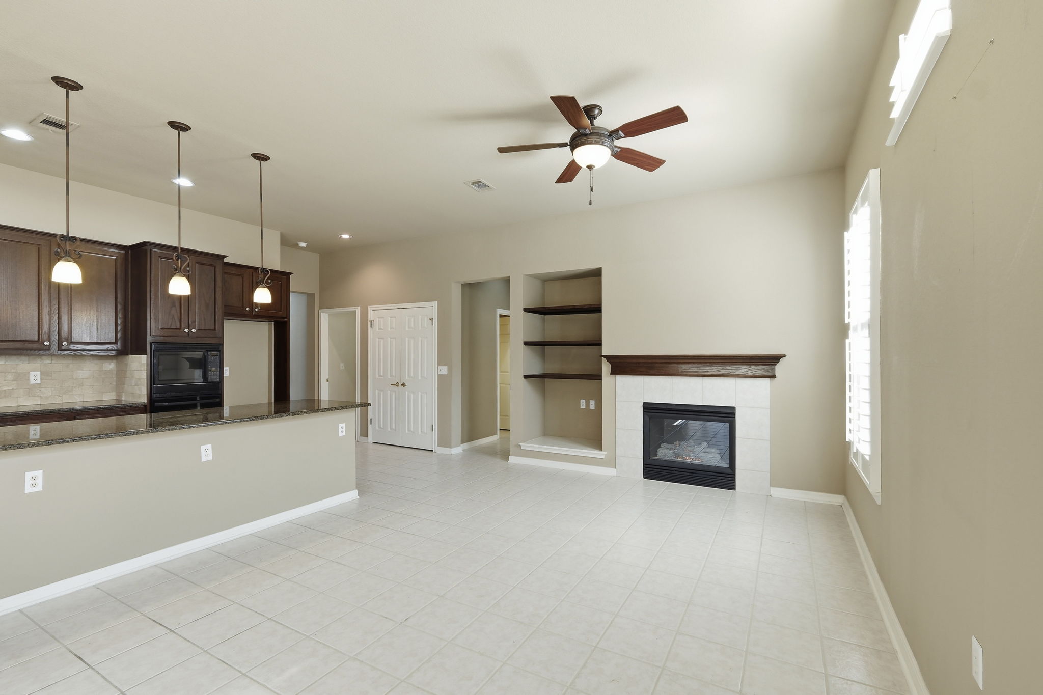 196 Whispering Wind Drive Georgetown, TX 78633 - Photo 7 of 34 a view of an empty room and a kitchen