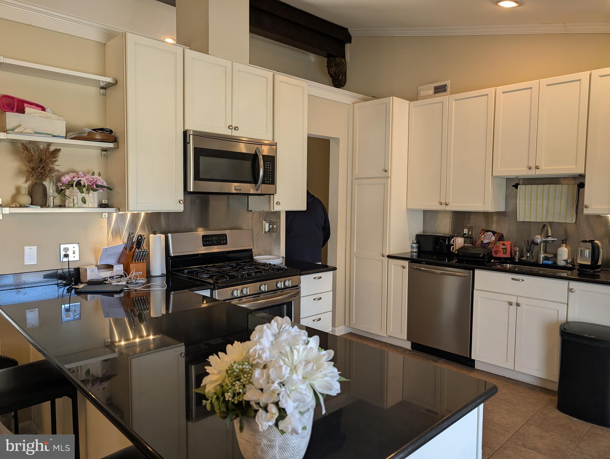335 Cherry Hill Boulevard Cherry Hill, NJ 08002 - Photo 6 of 17 a kitchen with stainless steel appliances granite countertop a sink dishwasher stove refrigerator and cabinets