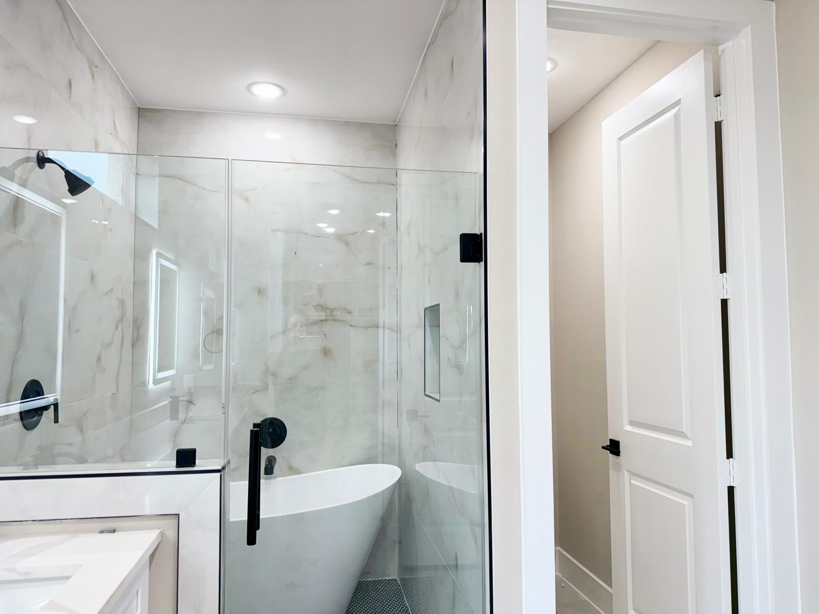 2518 Liguria Ln Spring Spring, TX 77388 - Photo 16 of 36 a bathroom with a glass shower door