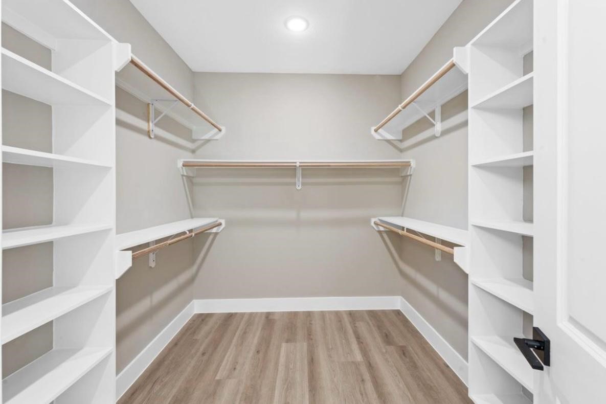 2518 Liguria Ln Spring Spring, TX 77388 - Photo 19 of 36 a view of walk in closet with empty racks