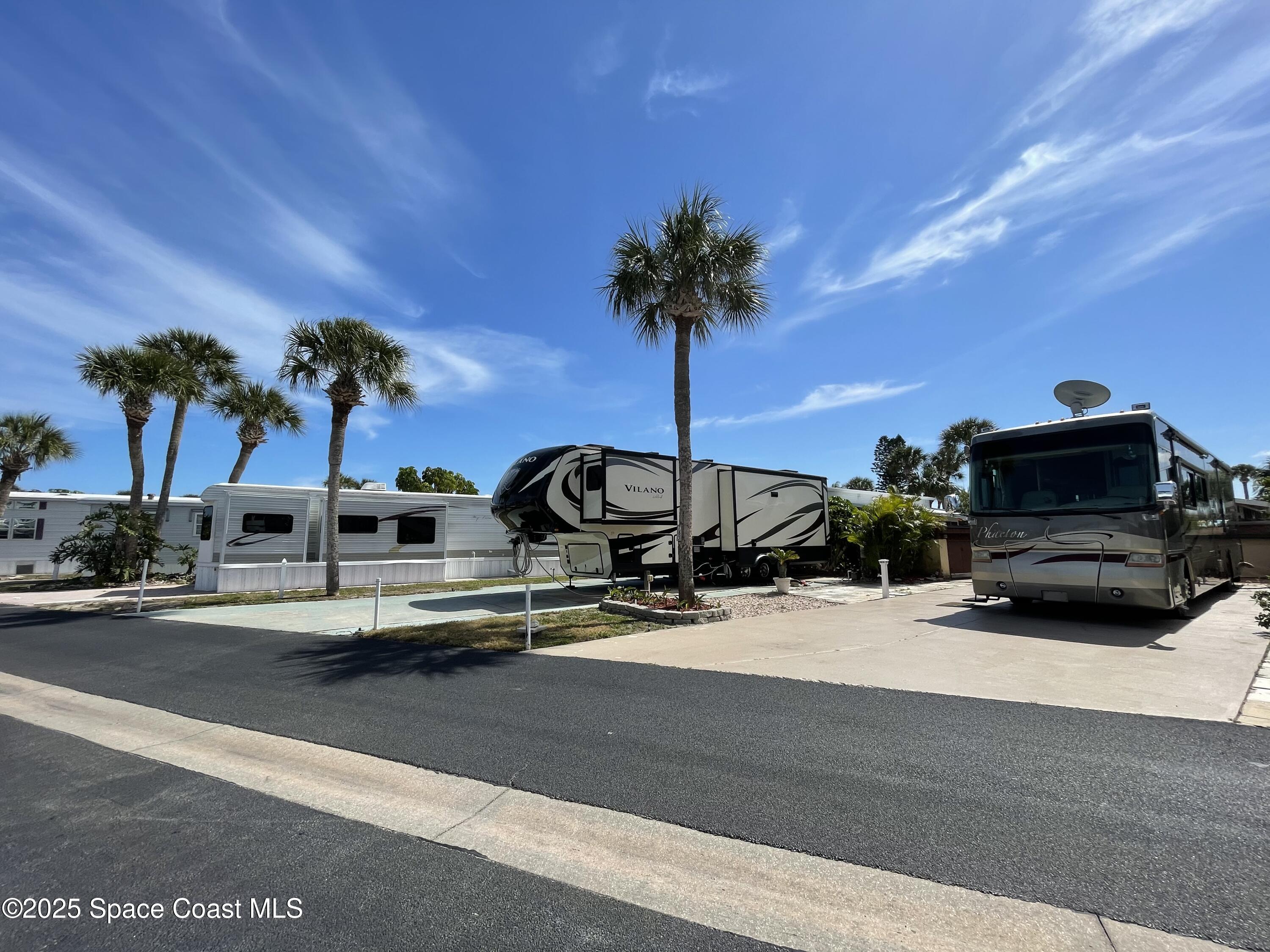 773 Carousel Lane Melbourne Beach, FL 32951 - Photo 5 of 19 a view of a swimming pool with a chair