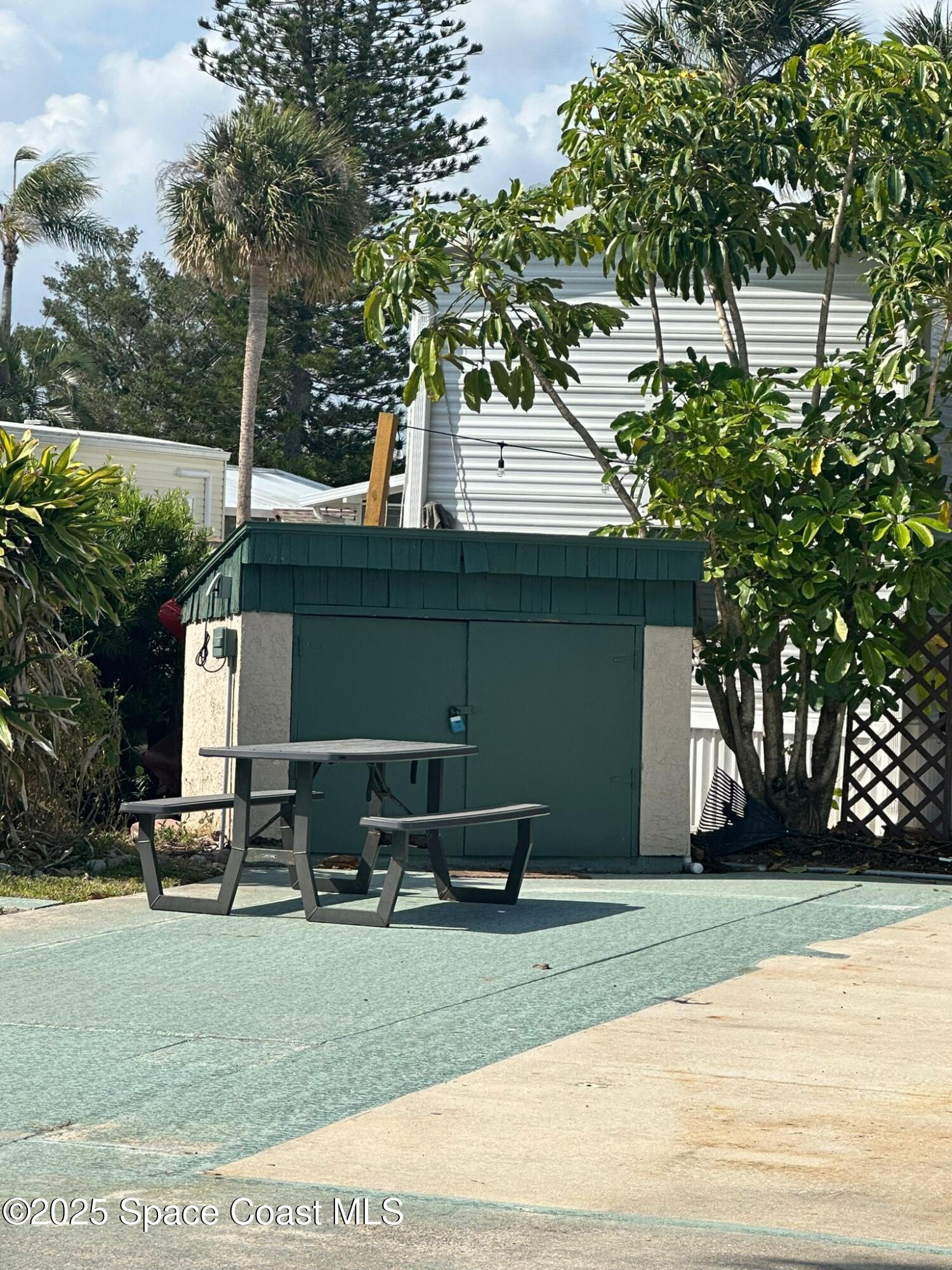 773 Carousel Lane Melbourne Beach, FL 32951 - Photo 6 of 19 a front view of a house with a yard