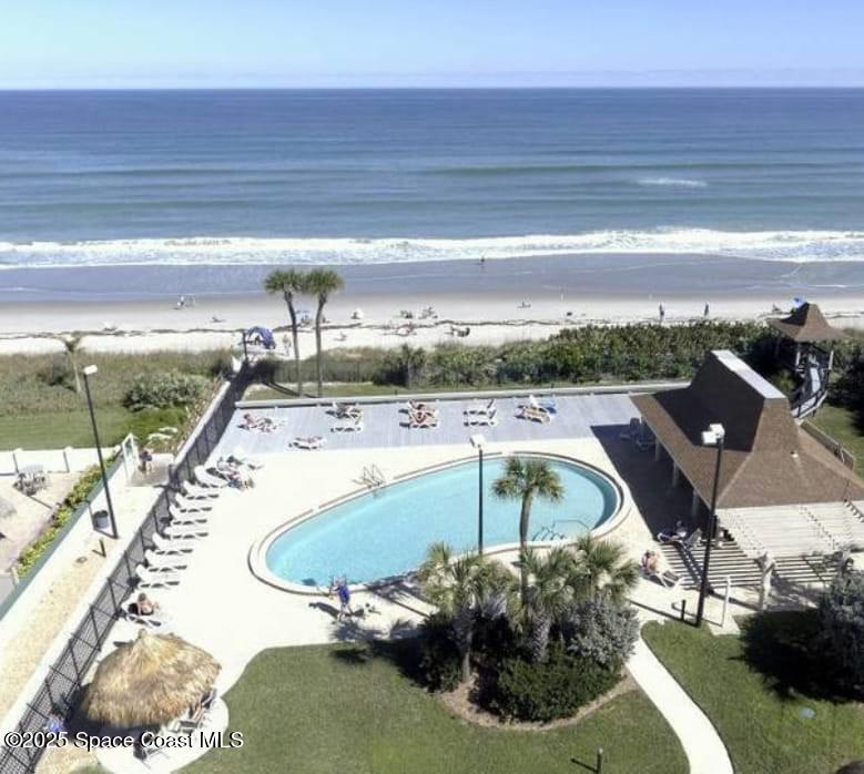 773 Carousel Lane Melbourne Beach, FL 32951 - Photo 7 of 19 a view of a swimming pool with a yard