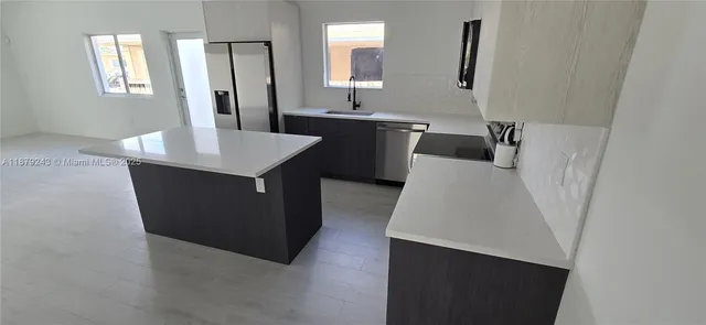 a bathroom with a sink a mirror and a bathtub