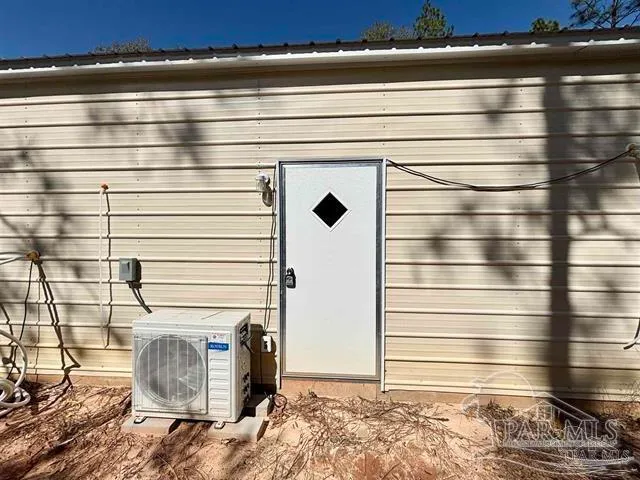 a bathroom with a shower and a sink