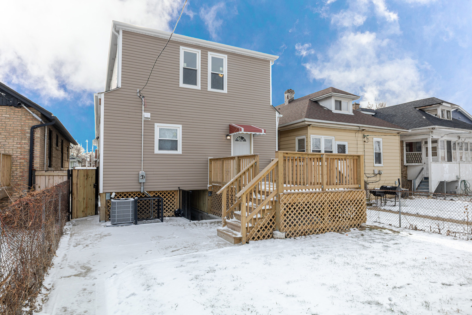 1730 East 83rd Place Chicago, IL 60617 - Photo 3 of 4 a view of a house with a snow in the yard
