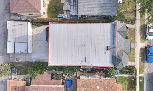 a view of a house with a wooden fence