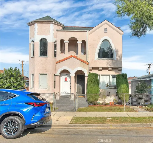 a view of a hallway with wooden shelves