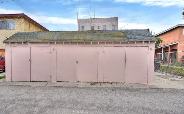 a bedroom with a bed and a desk