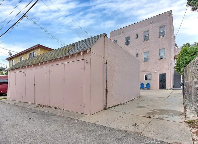 a bedroom with a bed and a desk