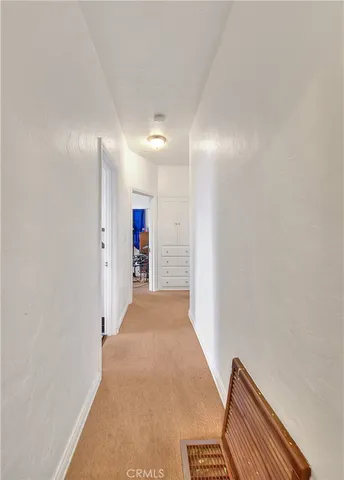a dining room with furniture and a window