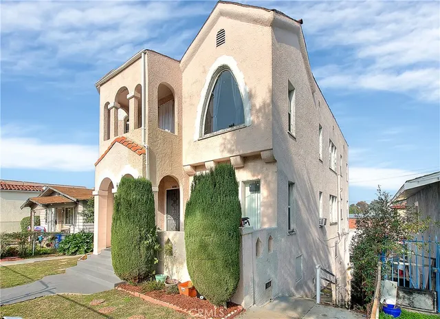 an aerial view of multiple houses with outdoor space