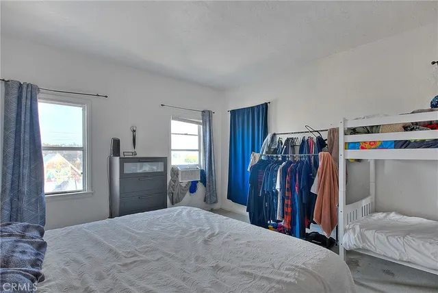 a kitchen with stainless steel appliances a stove a sink and a refrigerator