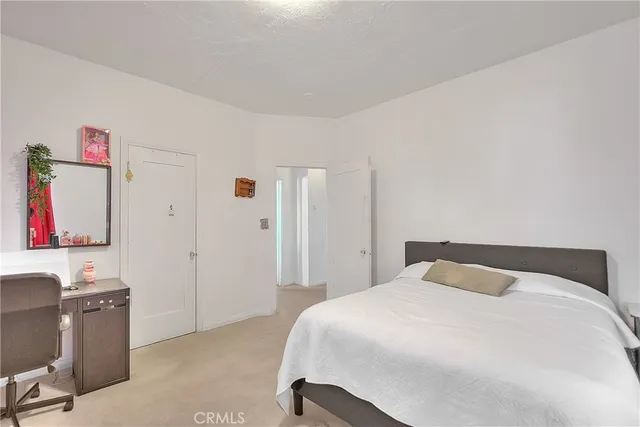 a vase of flowers besides of a table with six mirrors