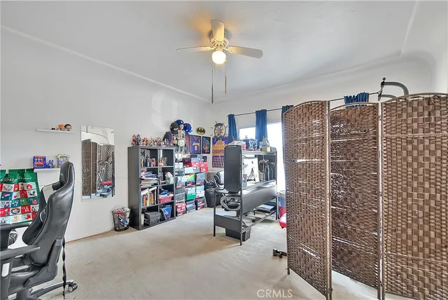 a storage room with furniture a rug and a window