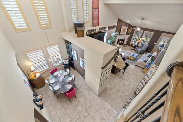 a view of a house with a yard and furniture