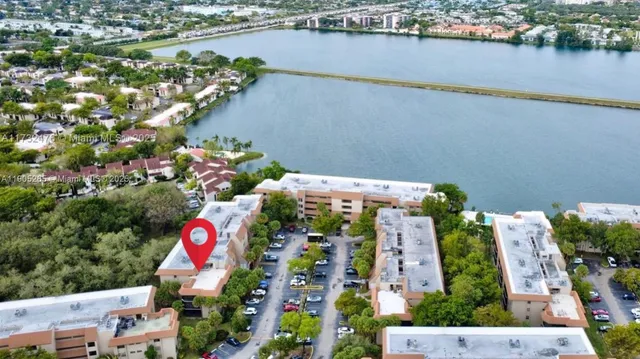 an aerial view of residential houses and outdoor space
