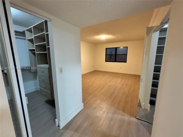 a bathroom with a tub and shower