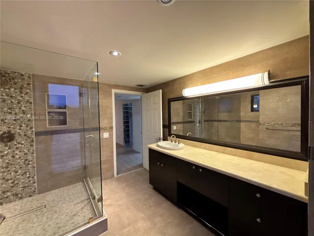 a view of a hallway with a white door and a window