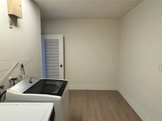 a view of swimming pool with outdoor seating and plants