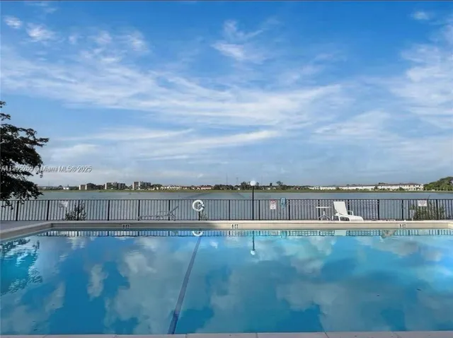a view of a swimming pool with a patio