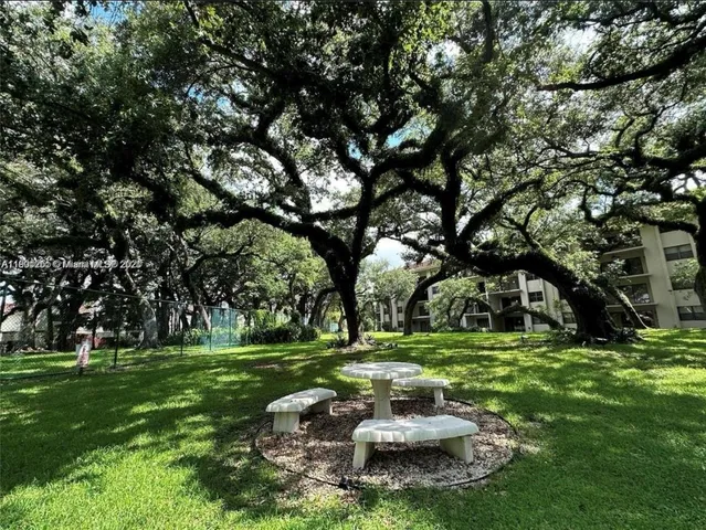 a view of a bench in a backyard