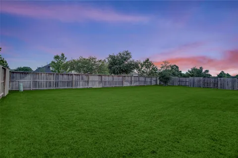 a view of a house with a big yard