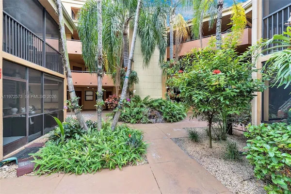 a view of potted plants in front of building